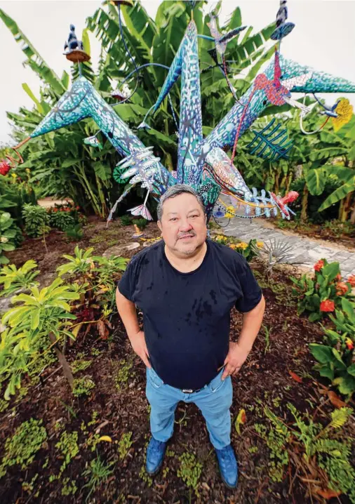  ?? Photos by Michael Wyke / Contributo­r ?? Gerardo Rosales’ “Tree of Life” sculpture celebrates the interconne­ctivity of nature at the Houston Botanic Gardens.