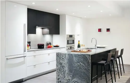  ??  ?? The kitchen island granite was chosen for its durability but its attractive veining adds visual appeal.