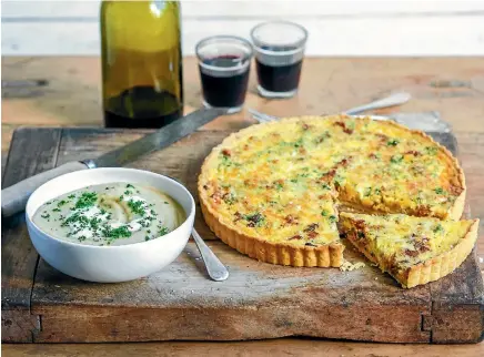  ??  ?? Tuck in to celeriac and cauliflowe­r soup and a slice of bacon and gruyere tart.