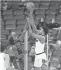  ?? SAM UPSHAW JR./LOUISVILLE COURIER-JOURNAL VIA USA TODAY SPORTS ?? Louisville’s David Johnson, right, shoots over Virginia Tech’s Tyrece Radford Wednesday in Louisville, Ky.