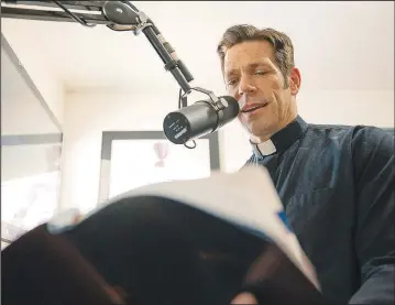  ?? (TNS/Ascension) ?? The Rev. Mike Schmitz of Duluth, Minn., is recording the entire Bible in 365 podcast episodes. The podcast is titled “The Bible in a Year.”