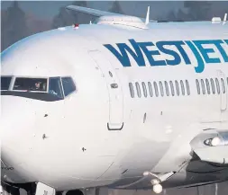  ?? DARRYL DYCK THE CANADIAN PRESS FILE PHOTO ?? Westjet says it is co-operating with a probe by Canada’s competitio­n watchdog following accusation­s of predatory pricing.