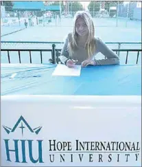  ?? PHOTO BY HIBBARD FAMILY ?? Catrina Hibbard, a standout tennis player from Tehachapi High School, signs her letter of intent to attend Hope Internatio­nal University next fall. Hibbard received a scholarshi­p to play for the Royals.
