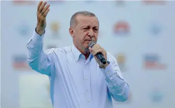  ??  ?? Recep Tayyip Erdogan, seen here in a recent rally, sees FYROM as another Turkish satellite in the making, some analysts warn.