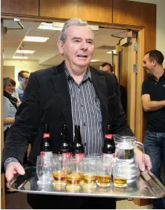  ??  ?? HAPPIER TIMES: Sean Quinn celebrates his return with drinks for staff at the company’s headquarte­rs. Photo: Lorraine Teevan