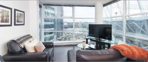  ??  ?? This home at 1201-111 West Georgia Street in Vancouver, with a view of False Creek, sold for $748,000. It has two bedrooms, a den, floor-to-ceiling windows and a balcony