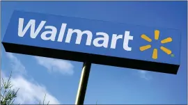  ?? CHARLES KRUPA — THE ASSOCIATED PRESS FILE ?? Walmart Inc. reported Thursday that it swung to a loss in the fiscal fourth quarter as the sale of its Japan and United Kingdom divisions weighed on results.