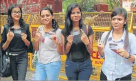  ?? PHOTOS: SHIVAM SAXENA/HT ?? These students realised that voting is their right and duty. Here they pose outside Ramjas college after casting their vote
