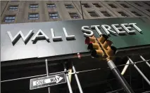  ?? MARK LENNIHAN / ASSOCIATED PRESS ?? Earnings reporting season is about to get underway for big companies, and the forecasts are grim. Wall Street expects S&P 500 companies to report profits plunged by the most since the depths of the Great Recession during the second quarter.