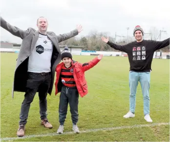  ??  ?? Gordon Sweeney, Alistair Sweeney, six, and Matthew Foster have recorded a song to celebrate Maidenhead United's 150th anniversar­y. All proceeds from it are set to be donated to the Maidenhead United FC Community Trust. Ref:133355-4