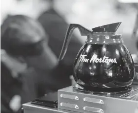  ?? CHRIS YOUNG/ CANADIAN PRESS FILES ?? “If you don’t have access to some of the foreign workers … it will ultimately also impact on the Canadians that work in that area,” says Tim Hortons head Marc Caira.