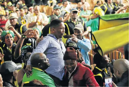  ?? Picture: MICHAEL PINYANA ?? REGIONAL RESHUFFLE : The ANC’s Dr W B Rubusana incoming regional chair Pumlani Mkolo is surrounded by supporters after beating Buffalo City Metro mayor Xola Pakati in East London at the weekend.