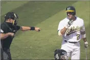  ?? ERIC RISBERG — THE ASSOCIATED PRESS ?? Home plate umpire Adam Hamari, left, gestures after the A’s Ramon Laureano, right, struck out against White Sox pitcher LucasGioli­to during the sixth inning of Game 1of their American League wild-card series on Tuesday in Oakland.