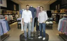  ?? SETH WENIG — THE ASSOCIATED PRESS ?? Untuckit founder Chris Riccobono, left, and CEO Aaron Sanandres pose for a picture in one of their stores in New York.