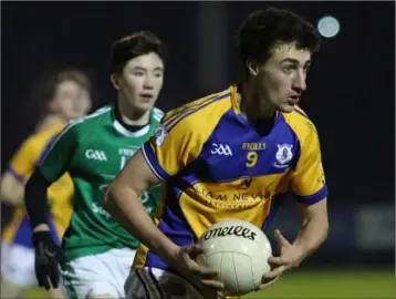  ??  ?? Shane Doyle of Taghmon-Camross races clear of Naomh Eanna attacker Charlie McGuckin.