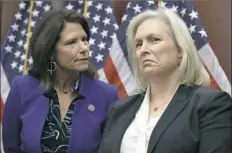  ?? Jacquelyn Martin/Associated Press ?? HARASSMENT ADDRESSED
Sen. Kirsten Gillibrand, D-N.Y., right, listens to Rep. Cheri Bustos, D-Ill., during a news conference on sexual harassment in the workplace on Wednesday on Capitol Hill in Washington.