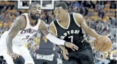  ?? TONY DEJAK/THE CANADIAN PRESS ?? Toronto Raptors’ Kyle Lowry drives past Cleveland Cavaliers’ Kyrie Irving during the first half in Game 2 of a second-round NBA basketball playoff series. Masai Ujiri insists all-star point guard Lowry wants to stay in Toronto. The Raptors president...