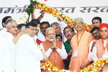  ?? — Reuters photo ?? Modi greets his party supporters during an election campaign rally in Meerut in the northern Indian state of Uttar Pradesh, India.