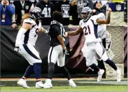  ?? BEN MARGOT ?? AP PHOTO BY Oakland Raiders wide receiver Michael Crabtree, center, fights with Denver Broncos nose tackle Domata Peko, left, and cornerback Aqib Talib during the first half of an NFL football game in Oakland, Sunday. Crabtree and Talib were ejected.