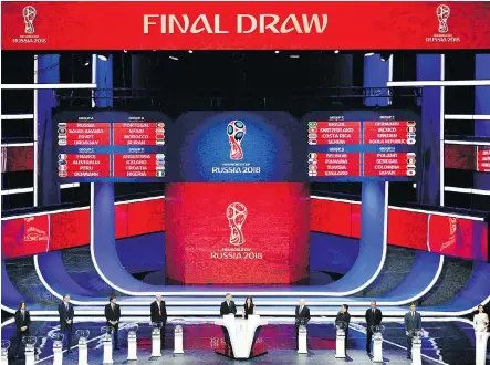  ?? MLADEN ANTONOV/AFP/ GETTY IMAGES ?? The 2018 World Cup draw was unveiled at the State Kremlin Palace in Moscow on Friday with host Russia landing in Group A with Saudi Arabia, Egypt and Uruguay, while Group H — Poland, Senegal, Colombia and Japan — is the only one without a former...