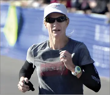  ?? Mark Crosse/Fresno Bee/TNS ?? ■ Molly Friel of Fresno, Calif., competes in a 2014 file image. At 50, she is the second-oldest woman ever to qualify for the Olympic Marathon Trials.