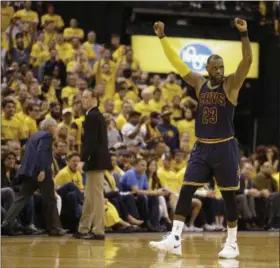  ?? MICHAEL CONROY — THE ASSOCIATED PRESS ?? Cavaliers forward LeBron James celebrates a basket in the second half of Game 3 of a first-round playoff game on April 20 in Indianapol­is. The Cavaliers came back from a 25-point deficit and defeated the Pacers .119-114.