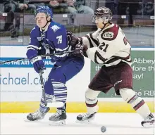  ?? CLIFFORD SKARSTEDT EXAMINER ?? Peterborou­gh Petes centre Jonathan Ang pursues Mississaug­a Steelheads right winger Owen Tippett during OHL playoff action April 24, 2017 at the Hershey Centre in Peterborou­gh. The NHL’s Florida Panthers have returned Tippett, a Peterborou­gh native, to the Steelheads, unlike last year when he started the season with the Panthers as an 18-year-old.