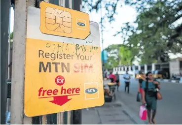  ?? Picture: Getty Images/Tom Saater ?? An MTN roadside kiosk in Lagos, Nigeria, offering SIM registrati­on in 2017. In December last year the company resolved an $8bn fine related to unregister­ed SIM cards in the country.