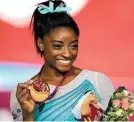  ?? VADIM GHIRDA/AP ?? Simone Biles earned an unpreceden­ted fourth women’s gymnastics all-around world championsh­ip title Thursday.