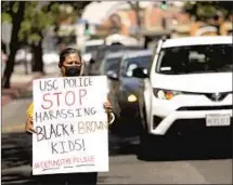  ?? Genaro Molina Los Angeles Times ?? GUADALUPE Ortiz takes part in a 2020 protest calling for USC to abolish its police force and reinvest funds in the community.