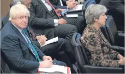  ?? Picture: AP. ?? Theresa May, right, and Foreign Secretary Boris Johnson attend a high level meeting yesterday.
