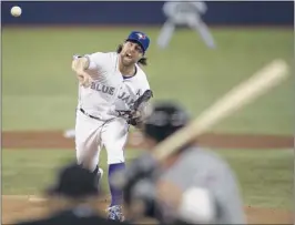  ?? FRANK GUNN/ASSOCIATED PRESS ?? Toronto Blue Jays starting pitcher R. A. Dickey throws to Michael Bourn of the Cleveland Indians as the teams opened their seasons in Toronto on Tuesday. The Indians won 4-1.