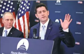  ?? J. SCOTT APPLEWHITE / ASSOCIATED PRESS ?? Speaker of the House Paul Ryan (center), with Majority Whip Steve Scalise, answers questions at a news conference as he defends a vote by Republican­s to release a classified memo on the Russia investigat­ion, at the Capitol in Washington, on Tuesday.