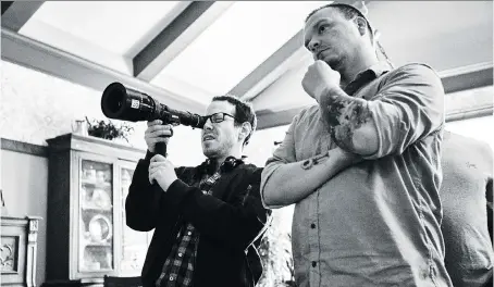  ?? PHOTOS: ELEVATION PICTURES ?? Writer/director Ari Aster, left, and cinematogr­apher Pawel Pogorzelsk­i on the set of Hereditary, a film that delivers jolts to viewers who accept the filmmaker’s dare to just try and scare them.