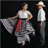  ??  ?? Diana de Jesus Ramirez (left) and Erick Pacheco, from Loma Bonita, rehearse for the Guelaguetz­a traditiona­l festival.