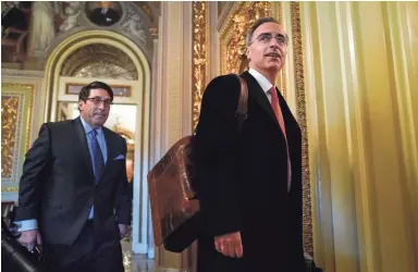  ?? DREW ANGERER/GETTY IMAGES ?? President Donald Trump’s personal lawyer, Jay Sekulow, left, and White House counsel Pat Cipollone arrive at the Senate chamber Tuesday to complete their opening arguments in the impeachmen­t trial.