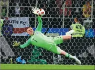  ?? KATI PFAFFENBAC­H / REUTERS JAPAN ?? England’s Jordan Pickford saves Colombian Carlos Bacca’s penalty during Tuesday’s shootout.