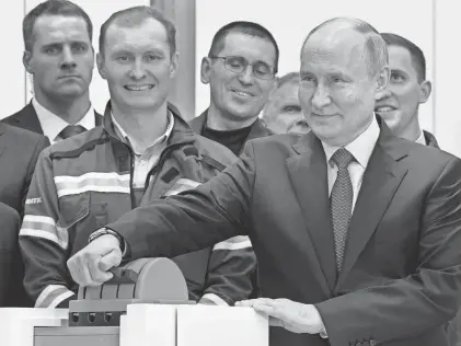  ?? ?? Russian President Vladimir Putin attends a July 20 ceremony at a Russian plant built to liquefy natural gas.