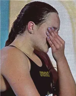  ?? AFP PIC ?? Israel's Anastasia Gorbenko reacts after being booed by spectators after her second place finish in the final of the women's 400m individual medley event in the World Aquatics Championsh­ips in Doha on Sunday.