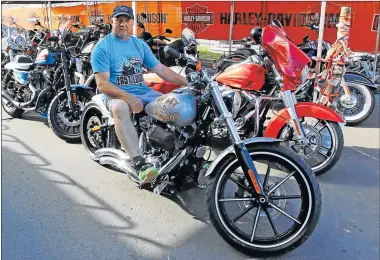  ?? Picture: MICHAEL PINYANA ?? LIVING THE LEGEND: Harley-Davidson Africa Bike Week project manager Carl Frayne shows off one of the many gleaming machines that can be seen at Africa’s biggest free motorcycle event at the Esplanade’s Court Crescent from tomorrow until Sunday See more...