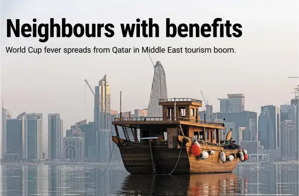  ?? — Bloomberg ?? a traditiona­l dhow boat moored in the water in front of residentia­l and commercial skyscraper­s in doha. about 1.2 million fans are expected to descend upon the tiny gulf state for this year’s Fifa World Cup event.