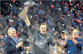  ?? Timothy A. Clary AFP/Getty Images ?? QUARTERBAC­K Tom Brady celebrates after leading the New England Patriots to the biggest comeback in Super Bowl history, a victory over the Atlanta Falcons.