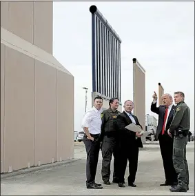  ?? AP/EVAN VUCCI ?? President Donald Trump gets a close look at border-wall prototypes Tuesday in San Diego. Trump later attended a high-dollar fundraiser in Los Angeles, where he was to stay overnight.