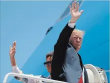  ?? EVAN VUCCI THE ASSOCIATED PRESS ?? U.S. President Donald Trump and his wife, Melania Trump, board Air Force One at Andrews Air Force Base, Md., for a flight to Japan.