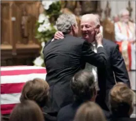  ?? ASSOCIATED PRESS ?? Former President George W. Bush embraces former Secretary of State James Baker, right, after he gave a eulogy during the funeral for former President George H.W. Bush at St. Martin’s Episcopal Church, Thursday, Dec. 6, 2018, in Houston.