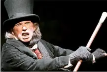  ??  ?? He’s got the mullet, he’s got the teeth… Tommy Steele as Ebenezer Scrooge