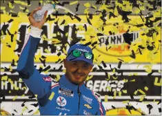  ?? JOHN LOCHER — THE ASSOCIATED PRESS ?? Elk Grove native Kyle Larson celebrates after winning a NASCAR Cup Series auto race at Las Vegas Motor Speedway on Sunday.