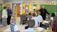  ?? DIGITAL FIRST MEDIA FILE PHOTO ?? The Rev. Joseph Maloney, pastor of St. Aloysius parish, welcomes students to the parish’s school’s new location in the former St. Pius X High School — a transition he helped to effectuate.