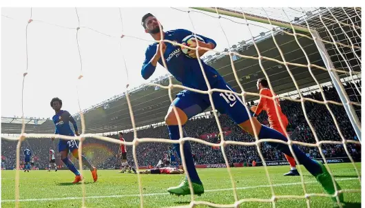  ??  ?? The saviour: Chelsea’s Olivier Giroud celebratin­g after scoring the first goal against Southampto­n in the Premier League match at St Mary’s yesterday. — AFP