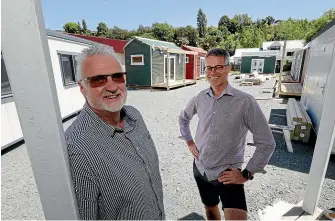  ?? MARTIN DE RUYTER/STUFF ?? Jaap Noteboom, left, team leader for the Salvation Army Housing First programme, and Habitat for Humanity Nelson general manager Nick Clarke at the cabin community created for homeless people in Nelson’s Vanguard St.